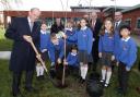 The Viscount Brookeborough, Her Majesty's Lord Lieutenant for County Fermanagh, planting a tree on The 70th Anniversary of The Accession to The Throne of Her Majesty Queen Elizabeth 11 at The Model School in Enniskillen. Also included are pupils