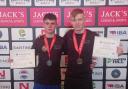 Rhys Owens and Anthony Malanaphy with medals and certifictaes.