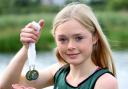 Annabel Morrison, with her gold medal 3000 meters and Silver 1500 meters at The All Ireland Club Championships..
