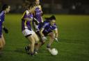 Aine McGovern stoops to get the ball ahead of Imelda Jones.
