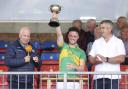 Kevin McDonnell lifts the winning trophy.