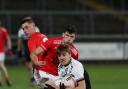 Eoghan McCabe breaks free from the challenge of Sean Conlon