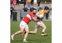 Conor Burns is bought to ground by Belnaleck's Kane Connor.