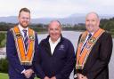 Bro. Norman Donaldson, Deputy County Grand Master, and Bro. Mervyn Byers (right), County Grand Master, with Phil McGrenaghan, from Cancer Connect, Northern Ireland – the chosen charity for the forthcoming Twelfth Celebration in Ballinamallard, Co.