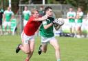 Adam Callaghan comes under pressure from Ruaidhri O'Keefe