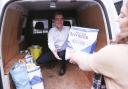 Rodney Edwards, Editor of The Impartial Reporter, helping to fill up the Foodbank Van.