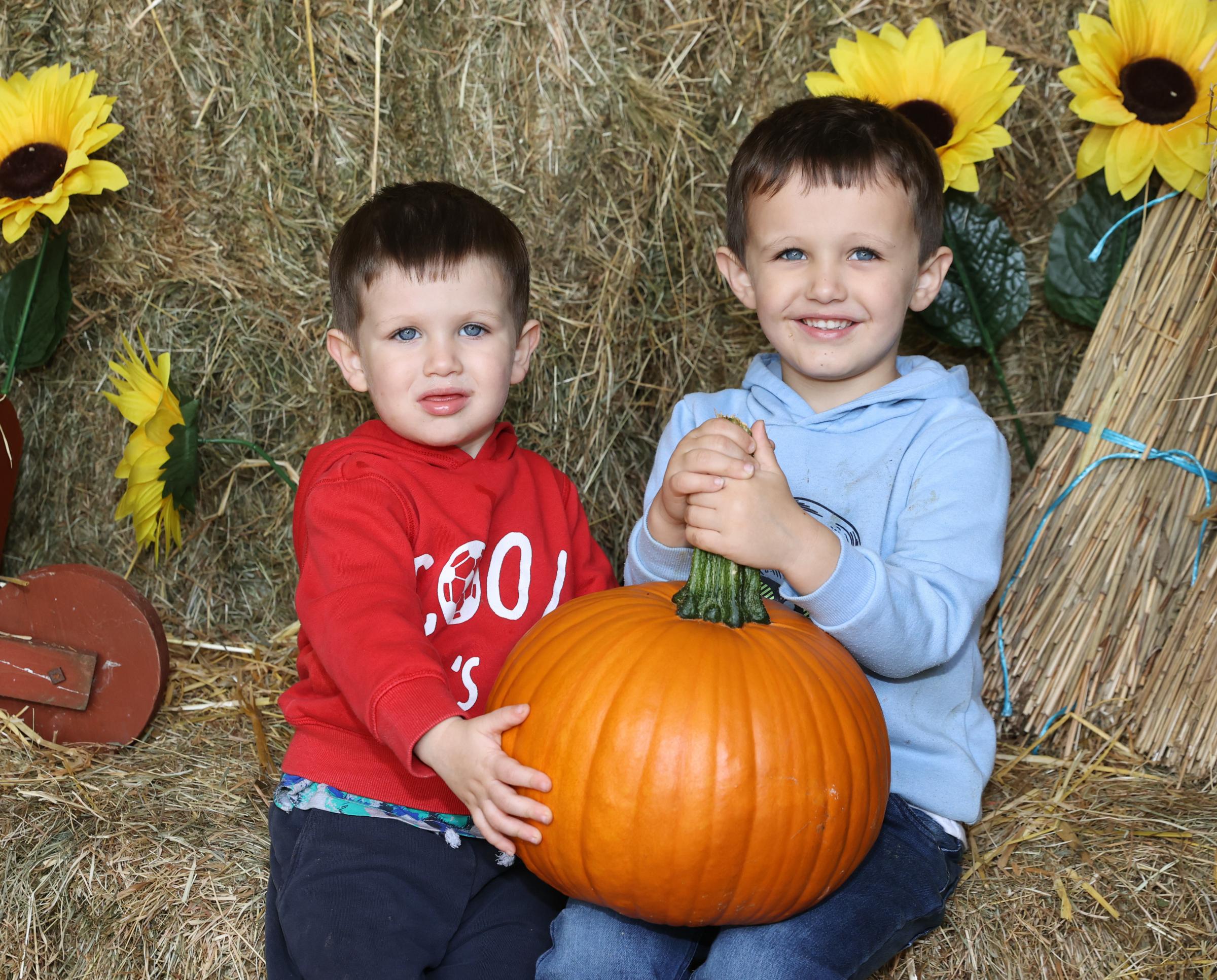 Connell and Austin Roche with their pumpkin at Lappins Vegetable Farm.