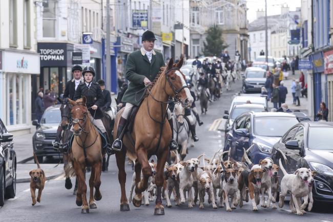 Master of the Hounds, Patrick Murphy leads the hunt through the streets of Enniskillen.