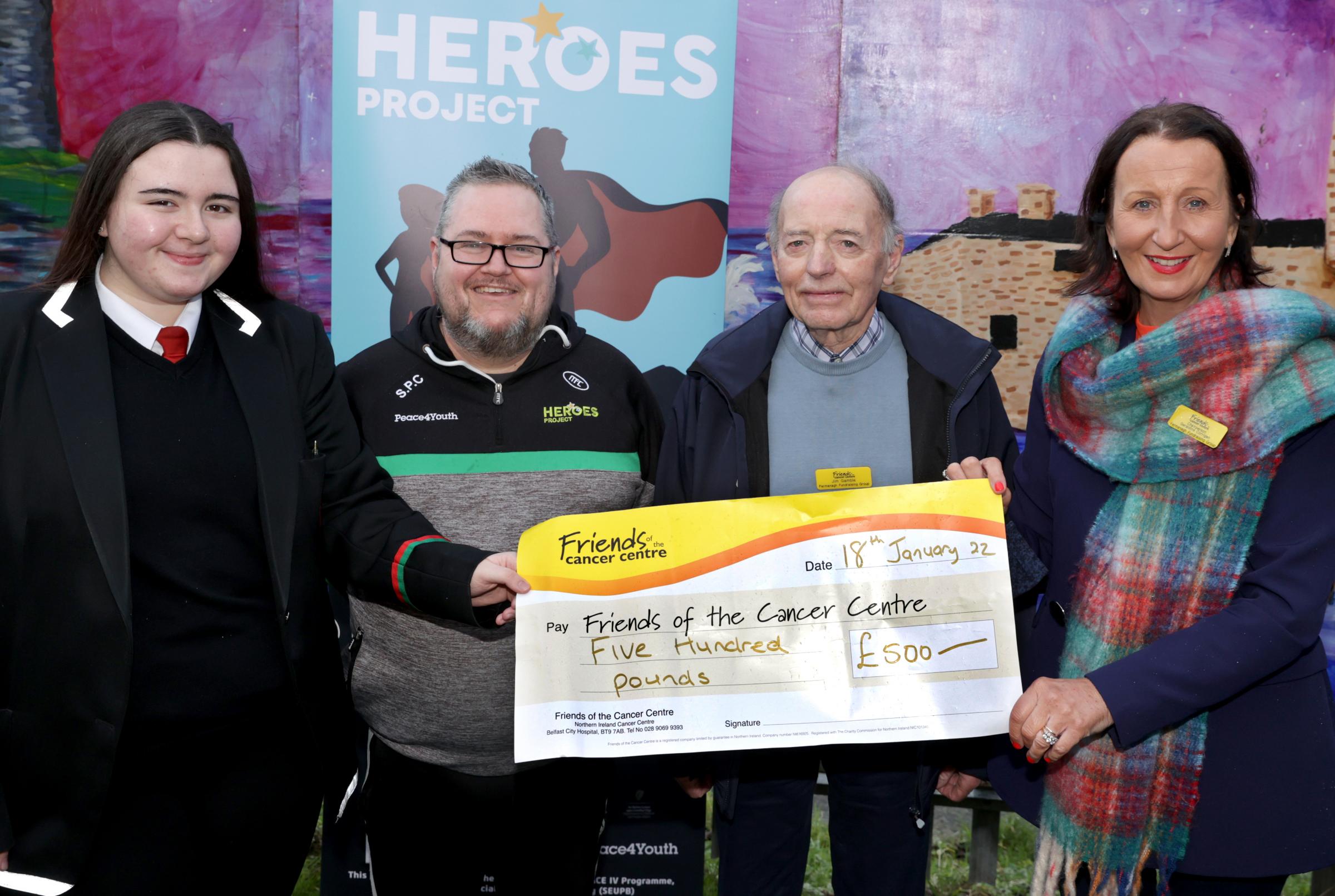Danielle McCaffrey, (left), The Heroes Project, handing over a cheque to Jim Gamble, BEM and Geraldine Corrigan, Friends of The Cancer Centre Fermanagh Branch. Also included is John Paul Curry, (second left), co-ordinator Devenish Partnership.