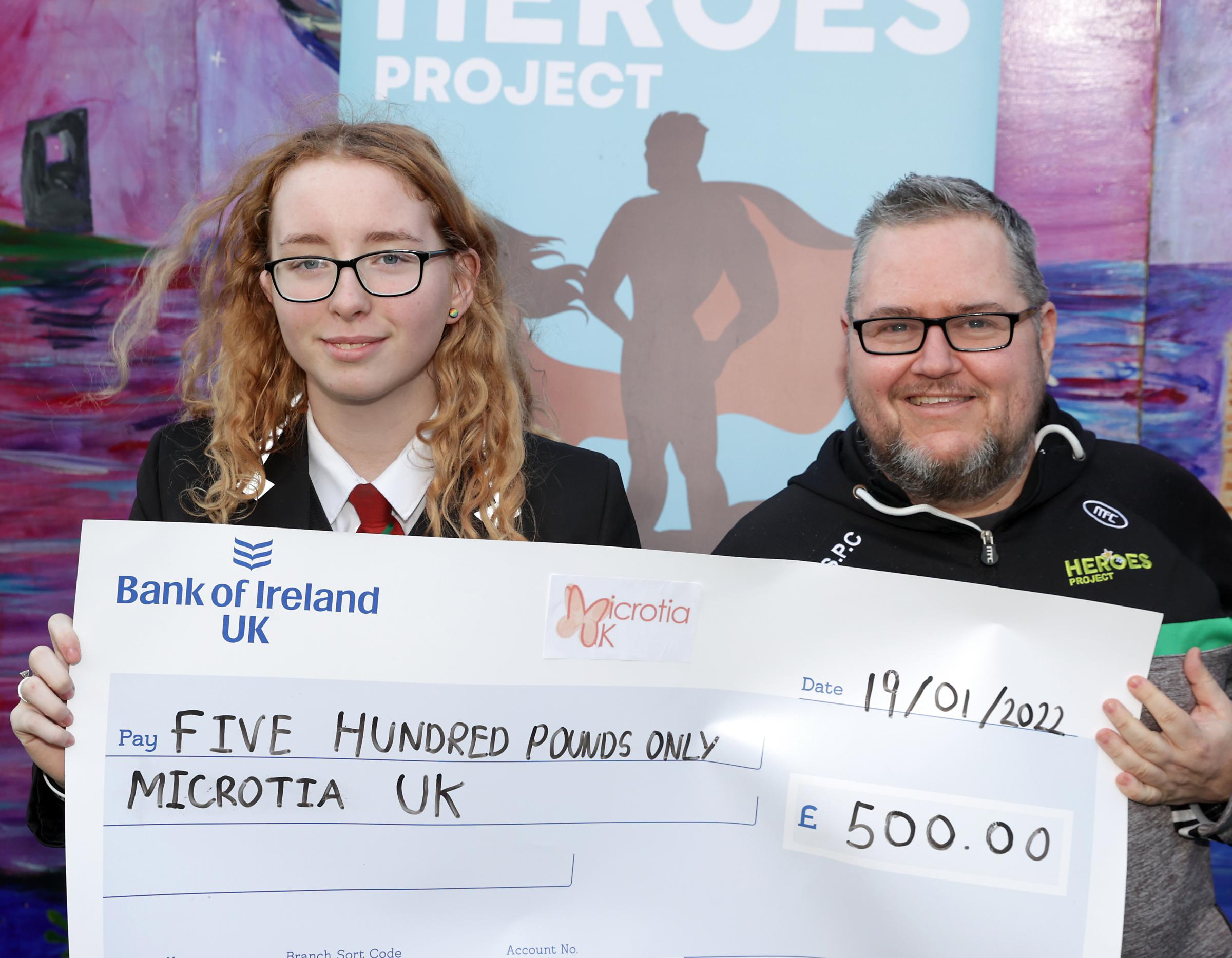 Aoife Gallagher, The Heroes Project and John Paul Curry, co-ordinator Devenish Partnership with a cheque for £500.00 for Microtia UK.