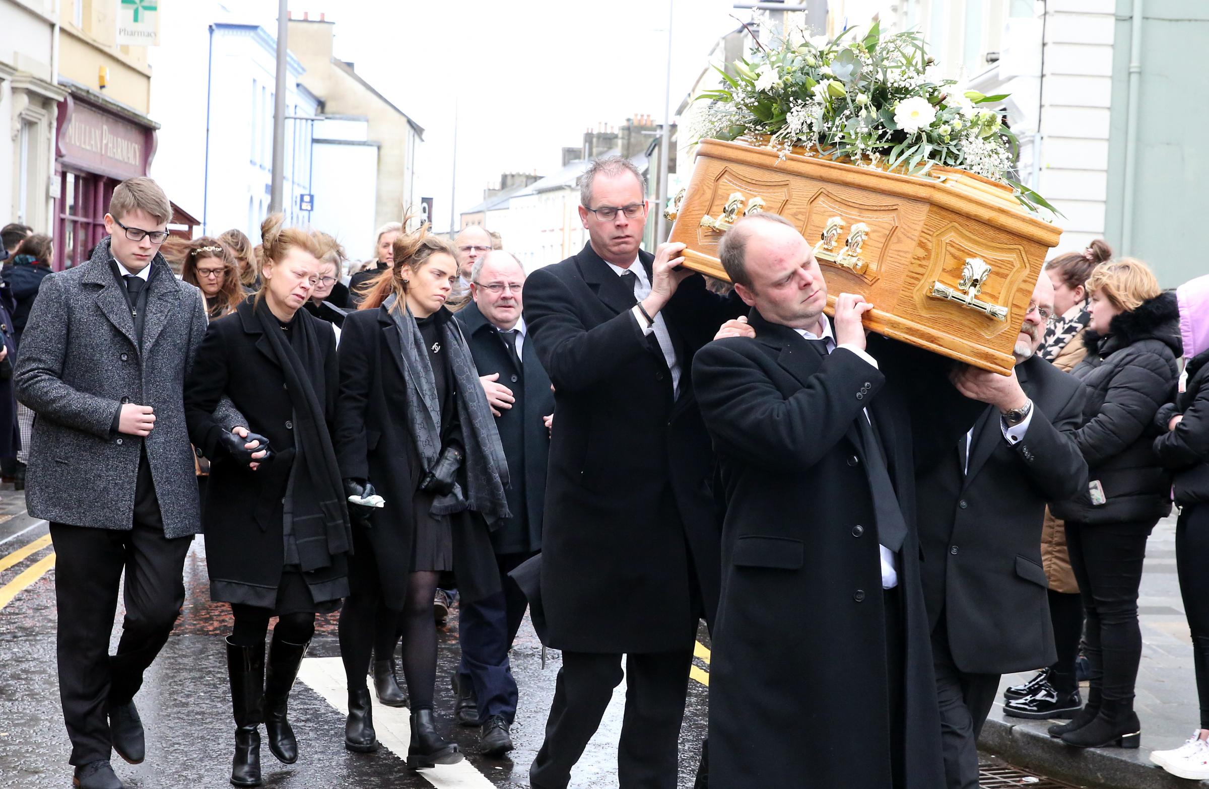 Family members and mourners of the late Hazel Johnston accompany her remains through the centre of Enniskillen. Photo: John McVitty.