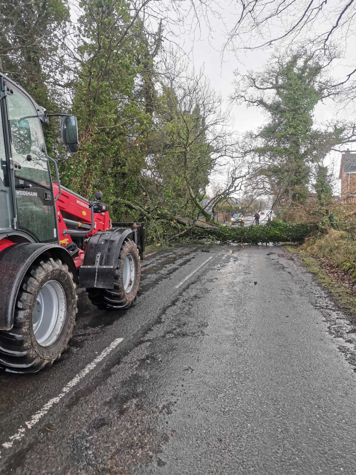 A local farmer assists with the removal of a tree on the Makenny Road, Ballinamallard.