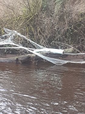 Fly tipping along the Colebrooke River.