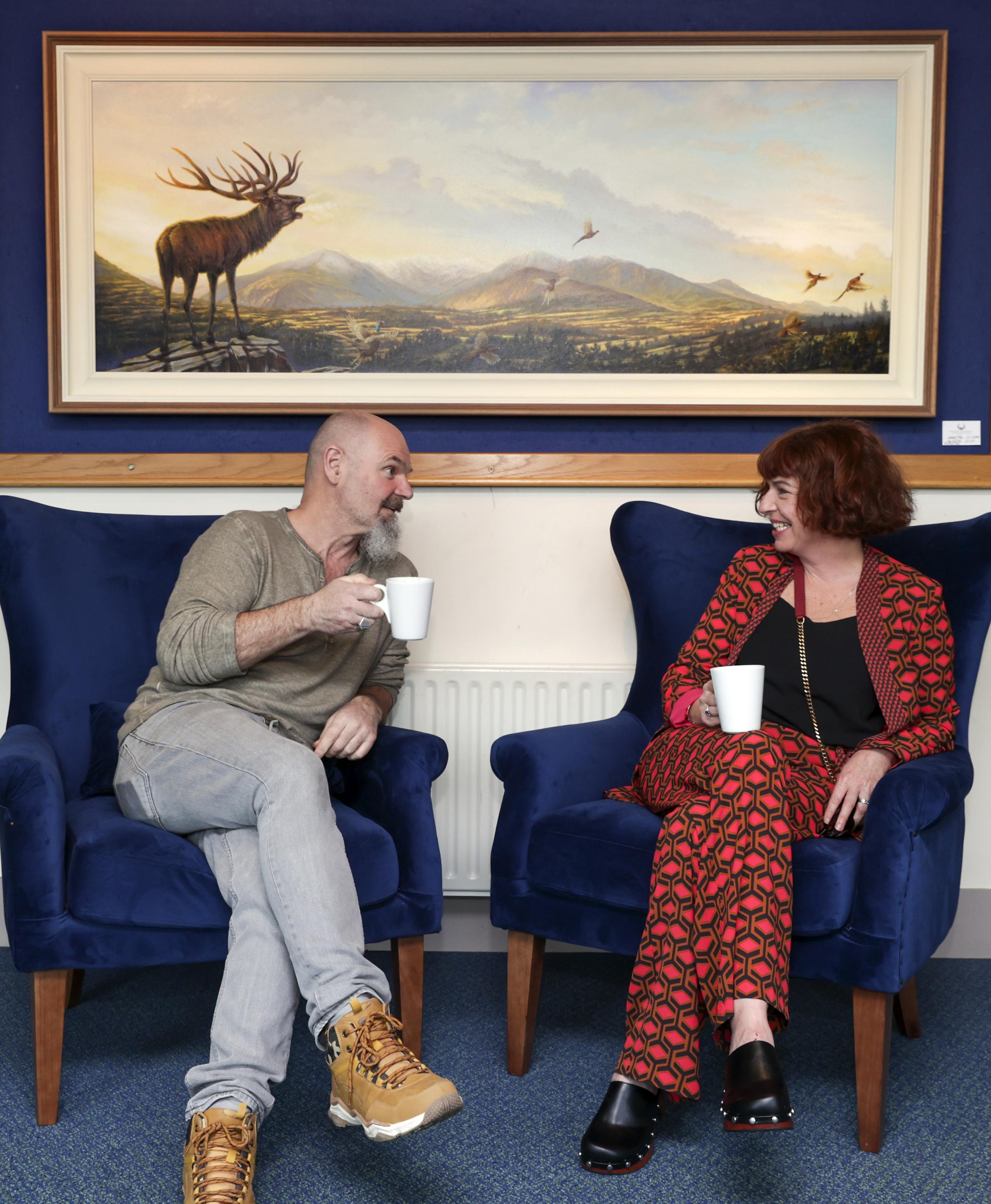 Laurence OToole, Artist, with one of his paintings The Call Over Healy Pass chatting with Ciara Hambly, Hambly and Hambly, Gallery, Dunbar House, Enniskillen.