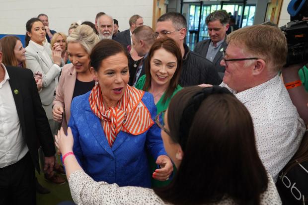 Sinn Fein leader Mary Lou McDonald (centre left) and Michelle O'Neill (back centre left) arrive at the Northern Ireland Assembly Election count centre at Meadowbank Sports arena in Magherafelt in Co County Londonderry. Picture date: Saturday May 7,