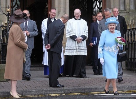 Britains Queen Elizabeth II (R) leaves St Michaels Roman Catholic Church in Enniskillen, Northern Ireland, on June 26, 2012. Queen Elizabeth II arrived in Northern Ireland on Tuesday for a visit that will include a historic meeting with deputy first