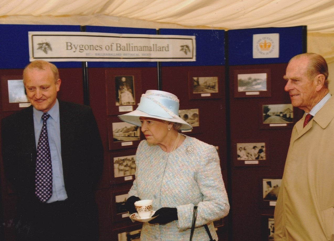 Left: Henry Robinson meeting The Queen during her and the Duke of Edinburgh’s visit to Ballinamallard in 2002.
