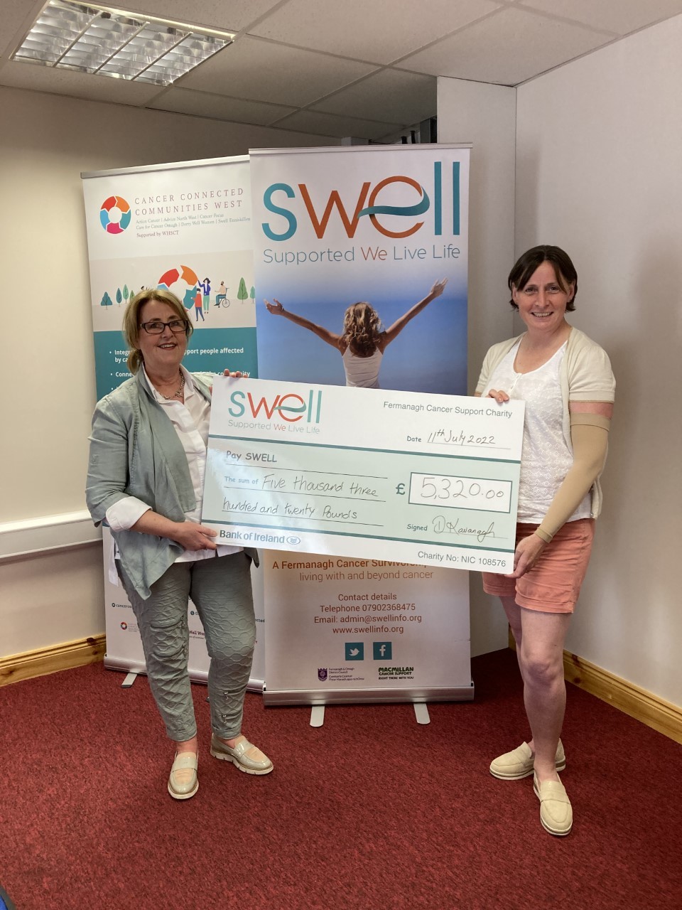 Denise Kavanagh presented Genevieve Irvine of SWELL with a cheque for £5,320 following her marathon run.