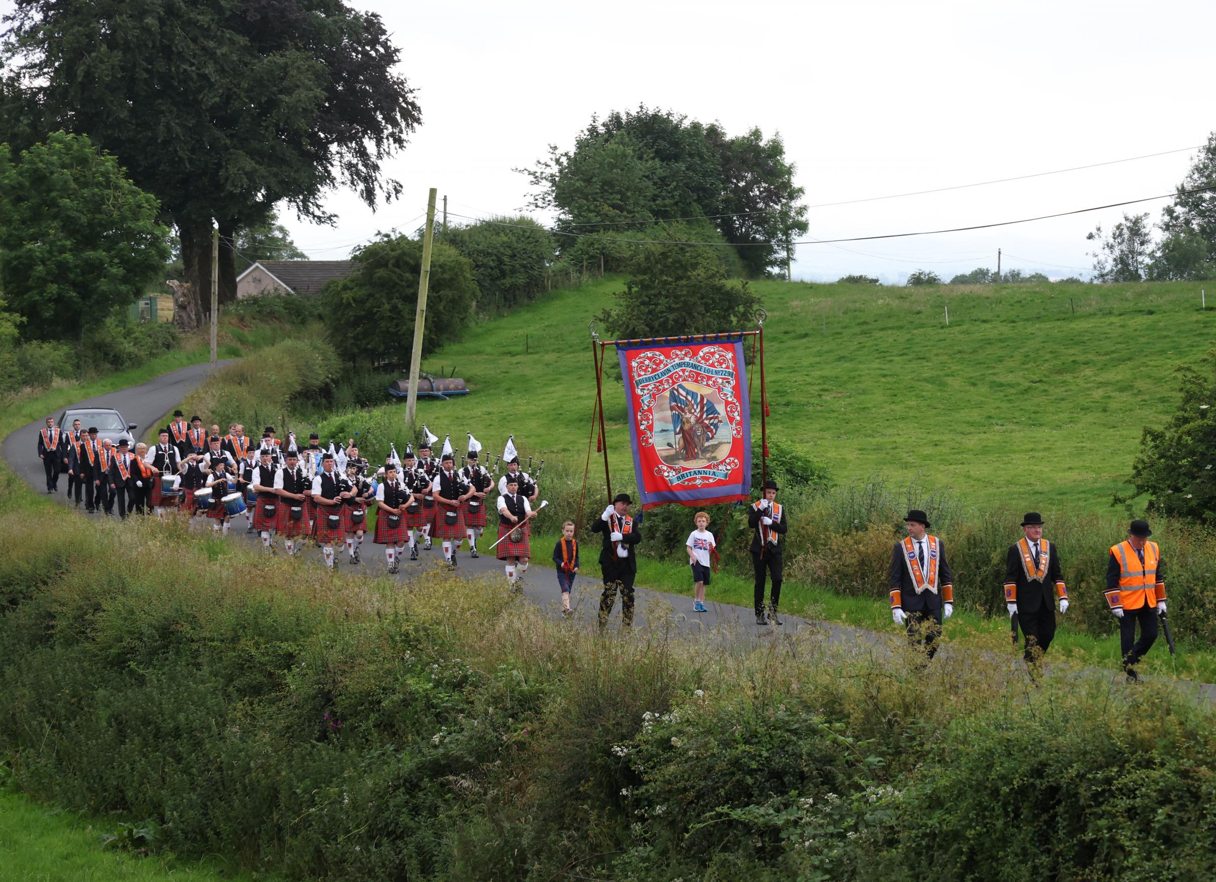 Derryclavin Pipe Band making their way from their hall to Lisbellaw..