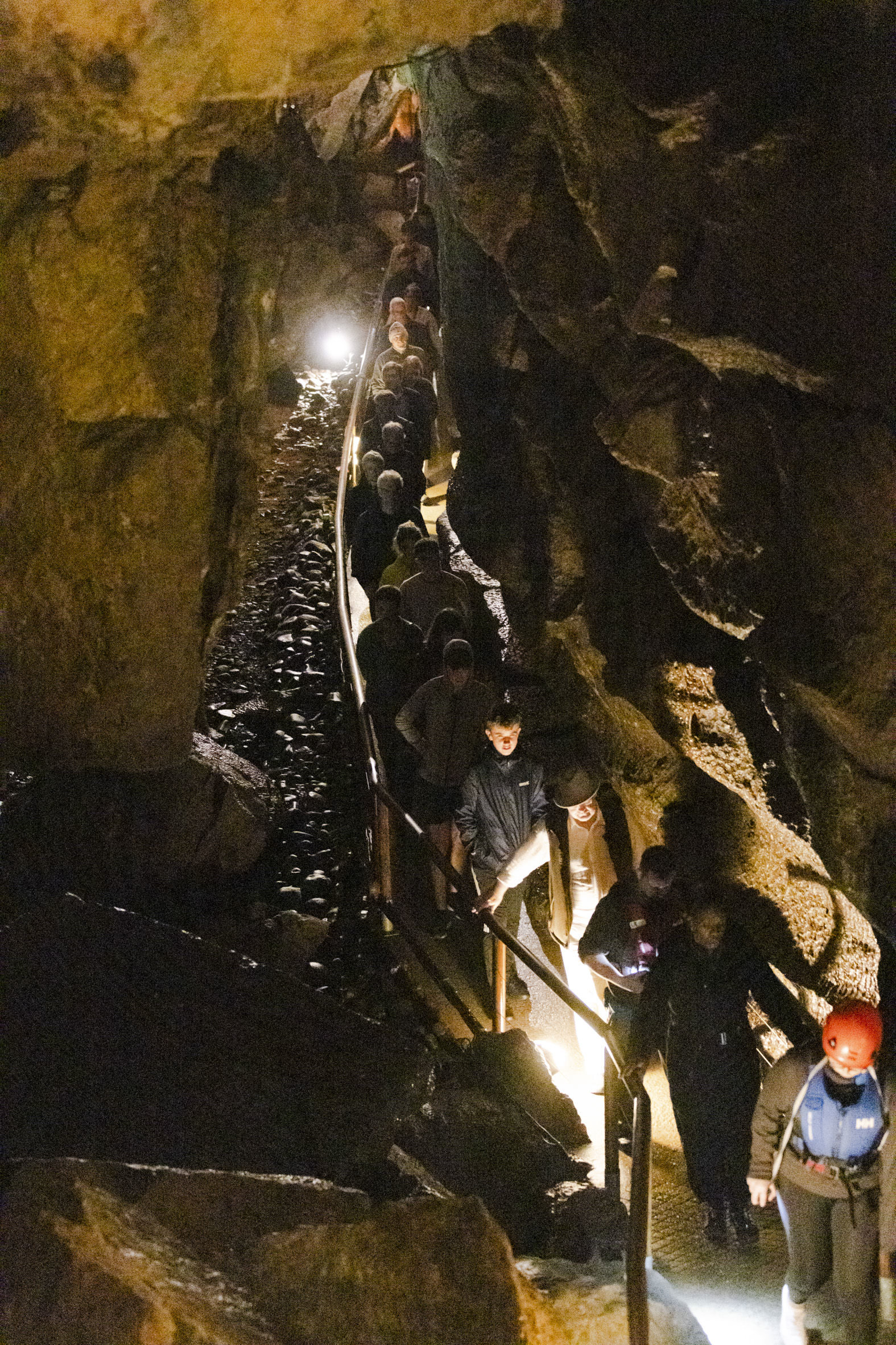 Singer Ruby Philogene leads the people out of the cave while singing all the way.