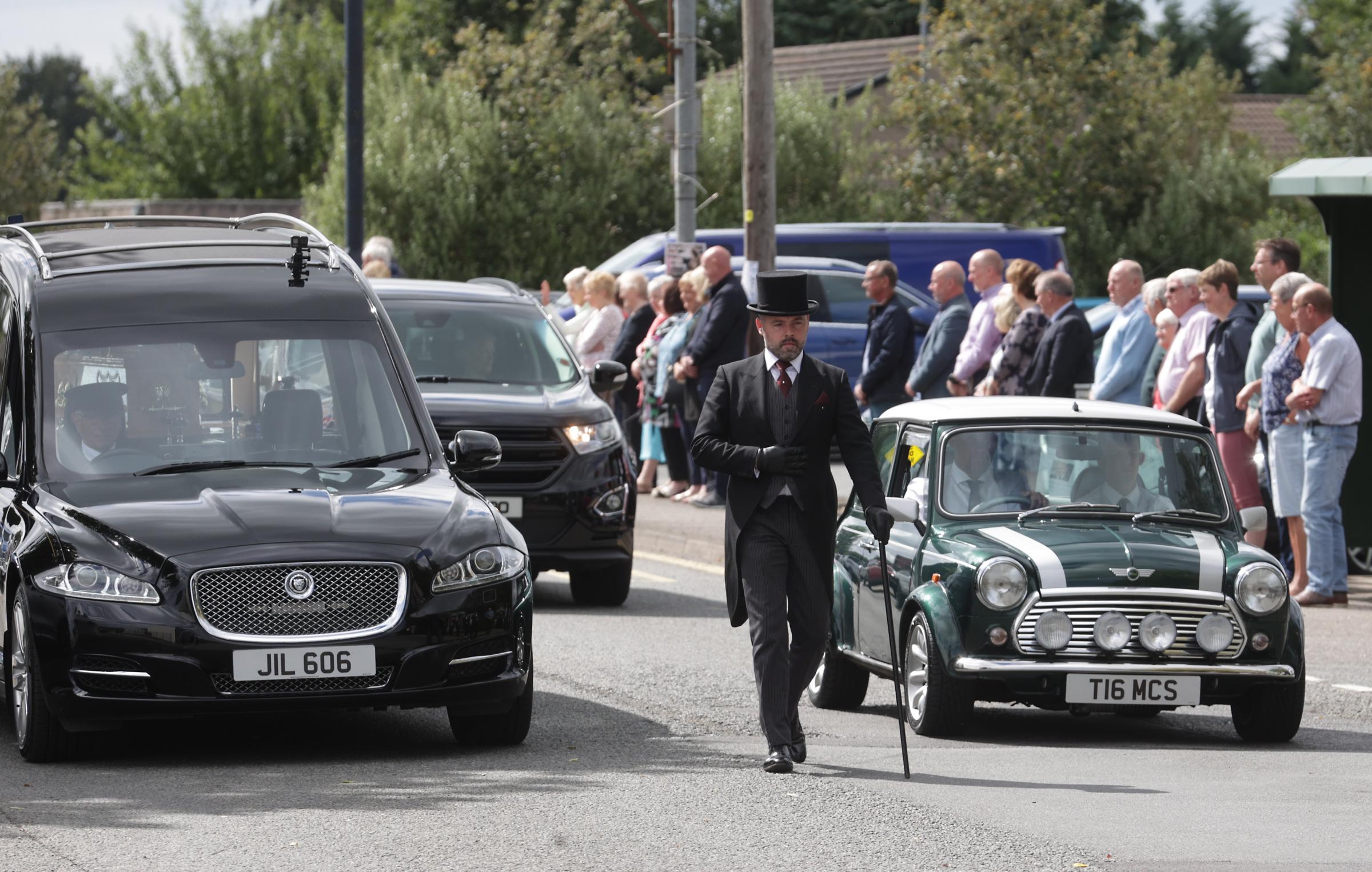 Hundreds line the street to pay their respects to the late William Lyons in Fivemiletown.