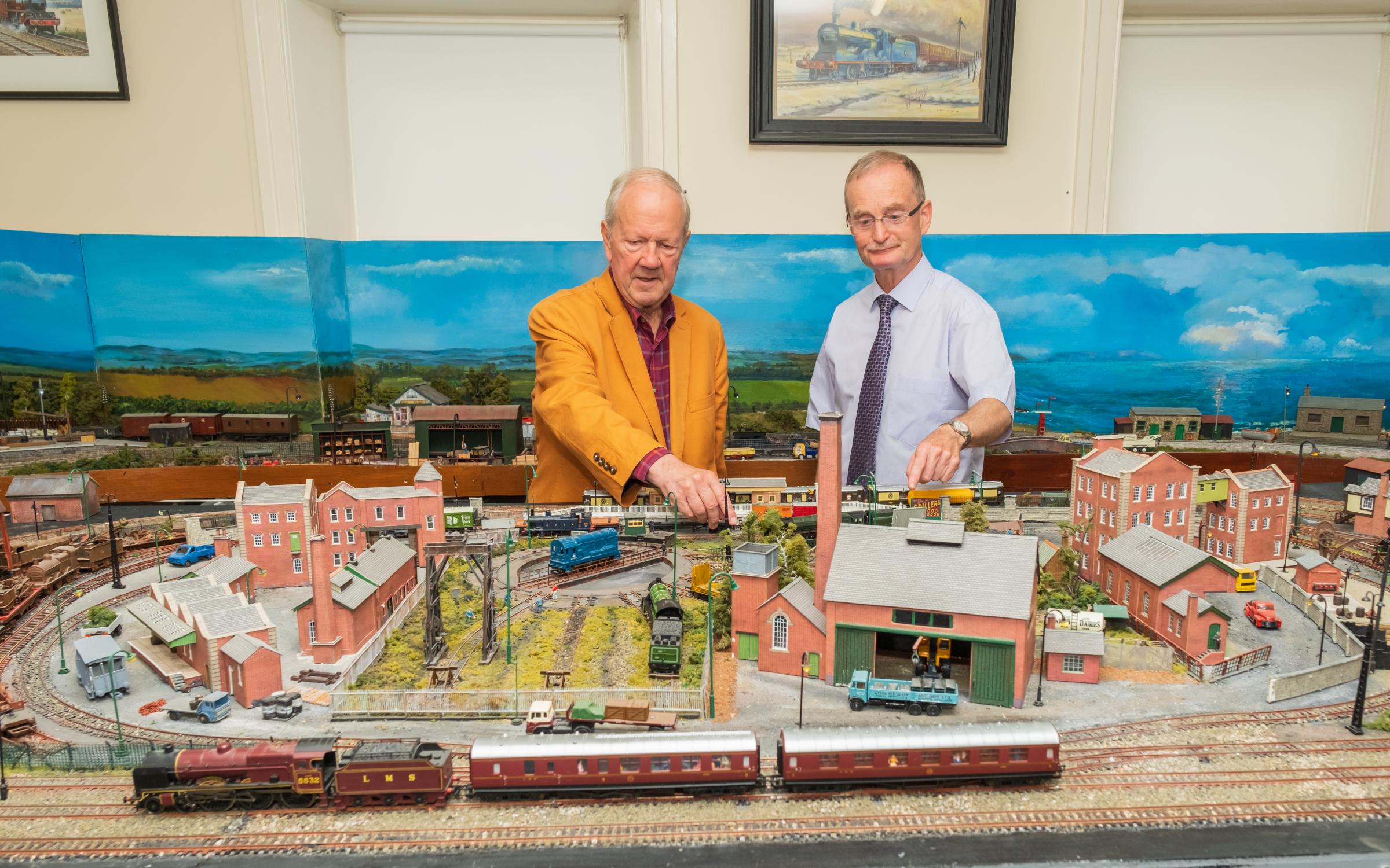 Lord Faulkner admires the model railway layout with Nigel Johnston at Headhunters Railway Museum.