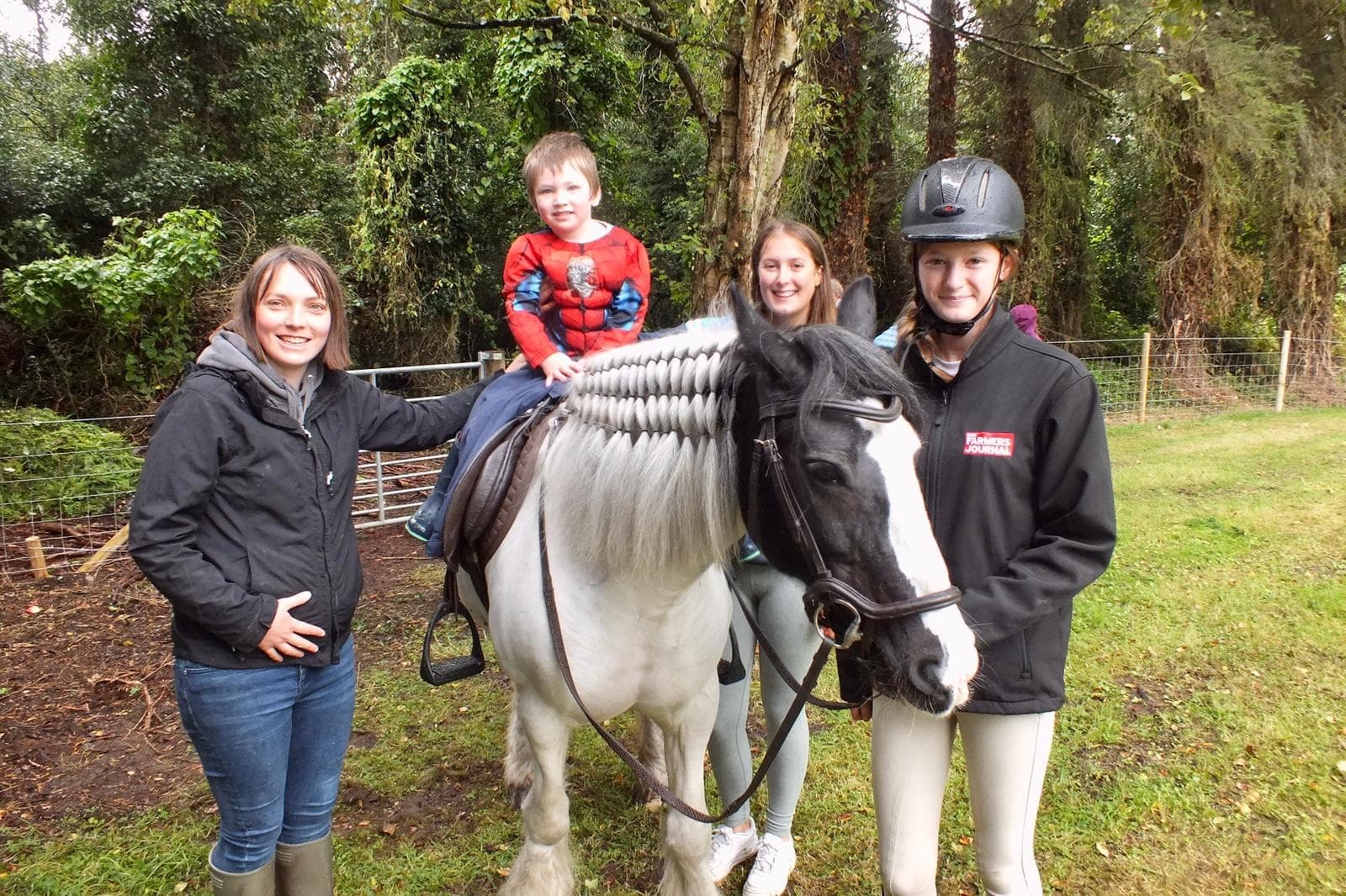 Children enjoying horse riding during the fundraising event at the Rectory of Garrison Parish Church.