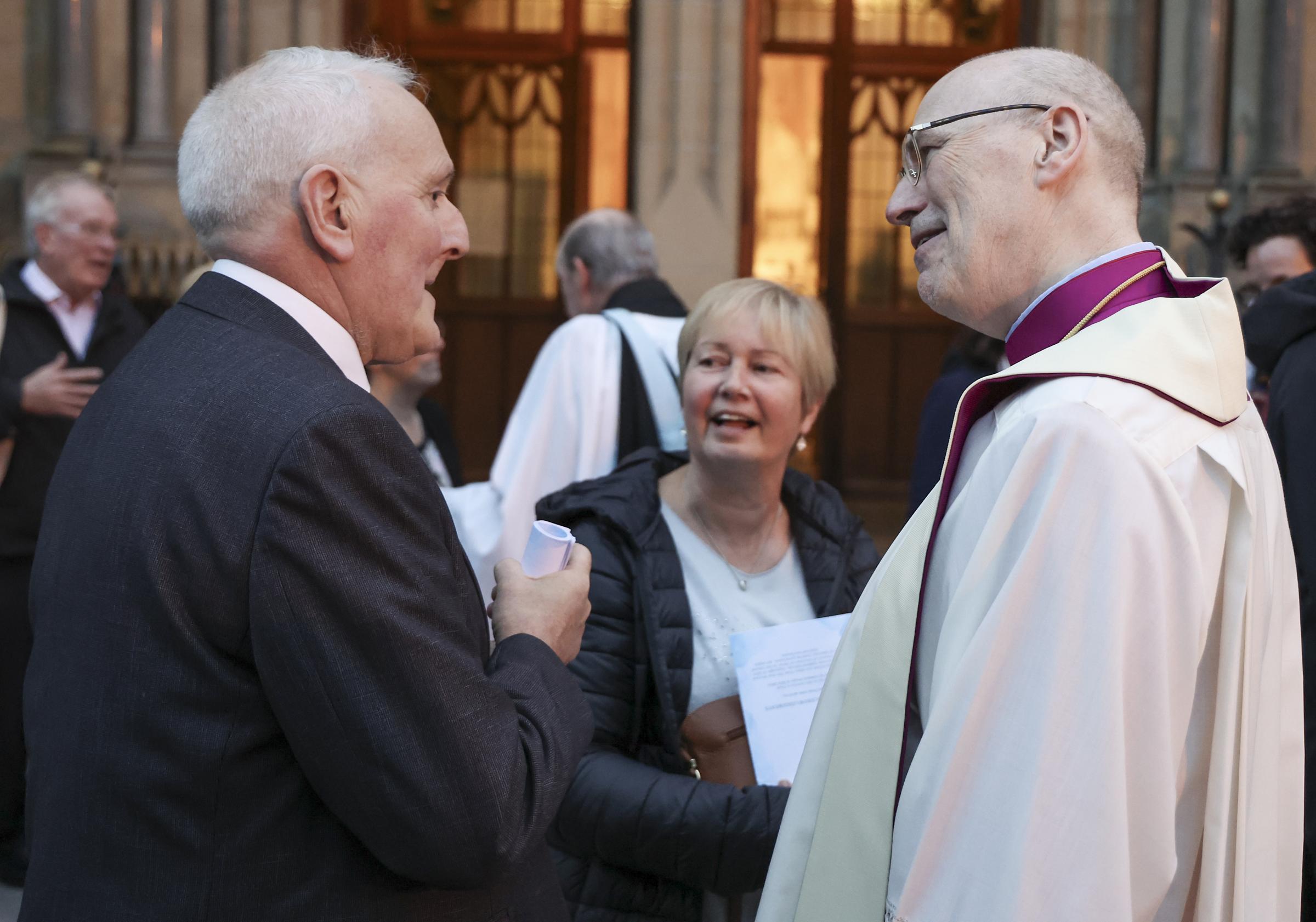 The Right Rev. Monsignor Peter OReilly, speaking to George Beacom, MBE, after the Service of Reflection for Her Majesty Queen Elizabeth II.
