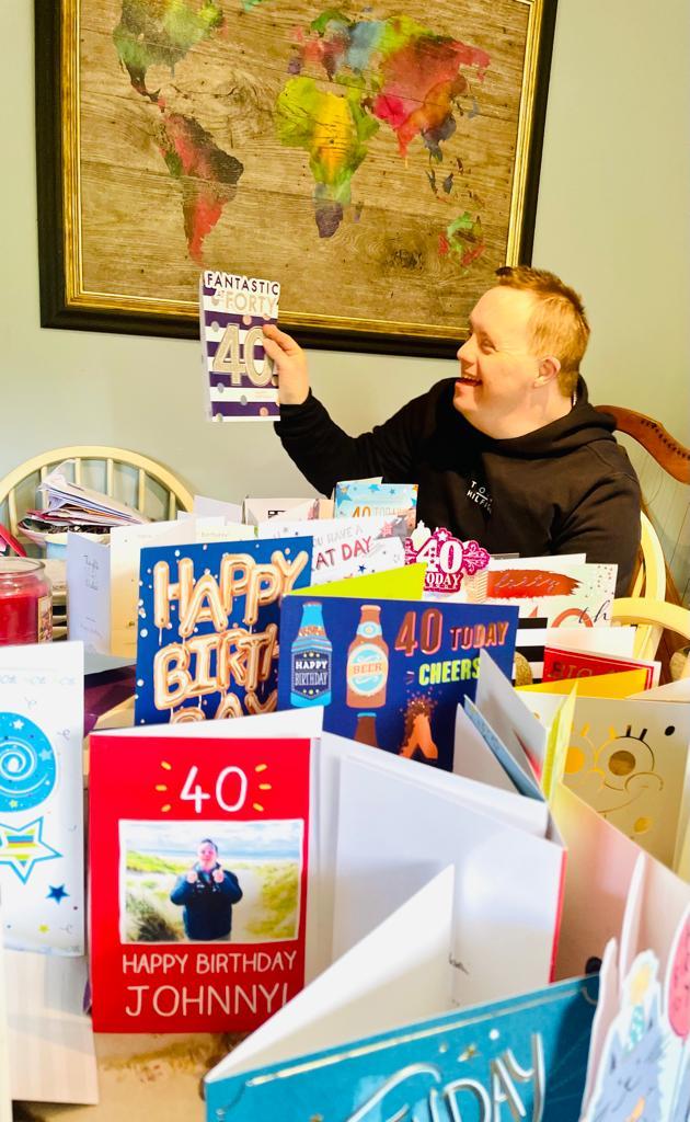 Jonathan Crawford admiring his birthday cards.