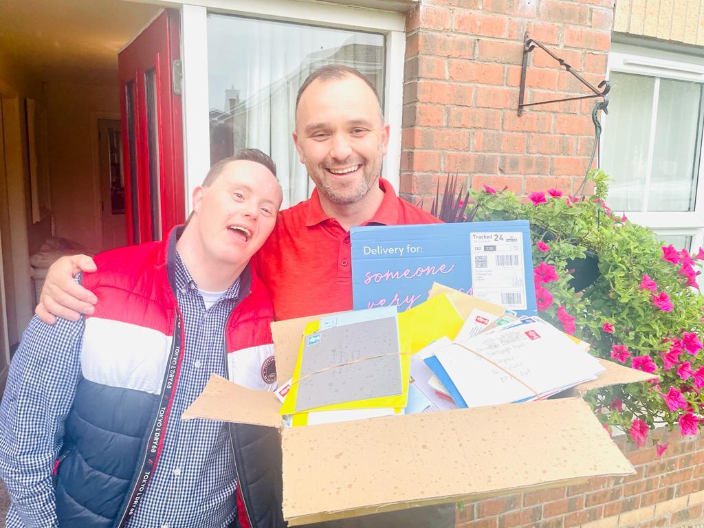 Jonathan pictured with postman Gareth Henry who was kept very busy delivering all the birthday cards. He really enjoyed seeing the postmarks from all over the world .