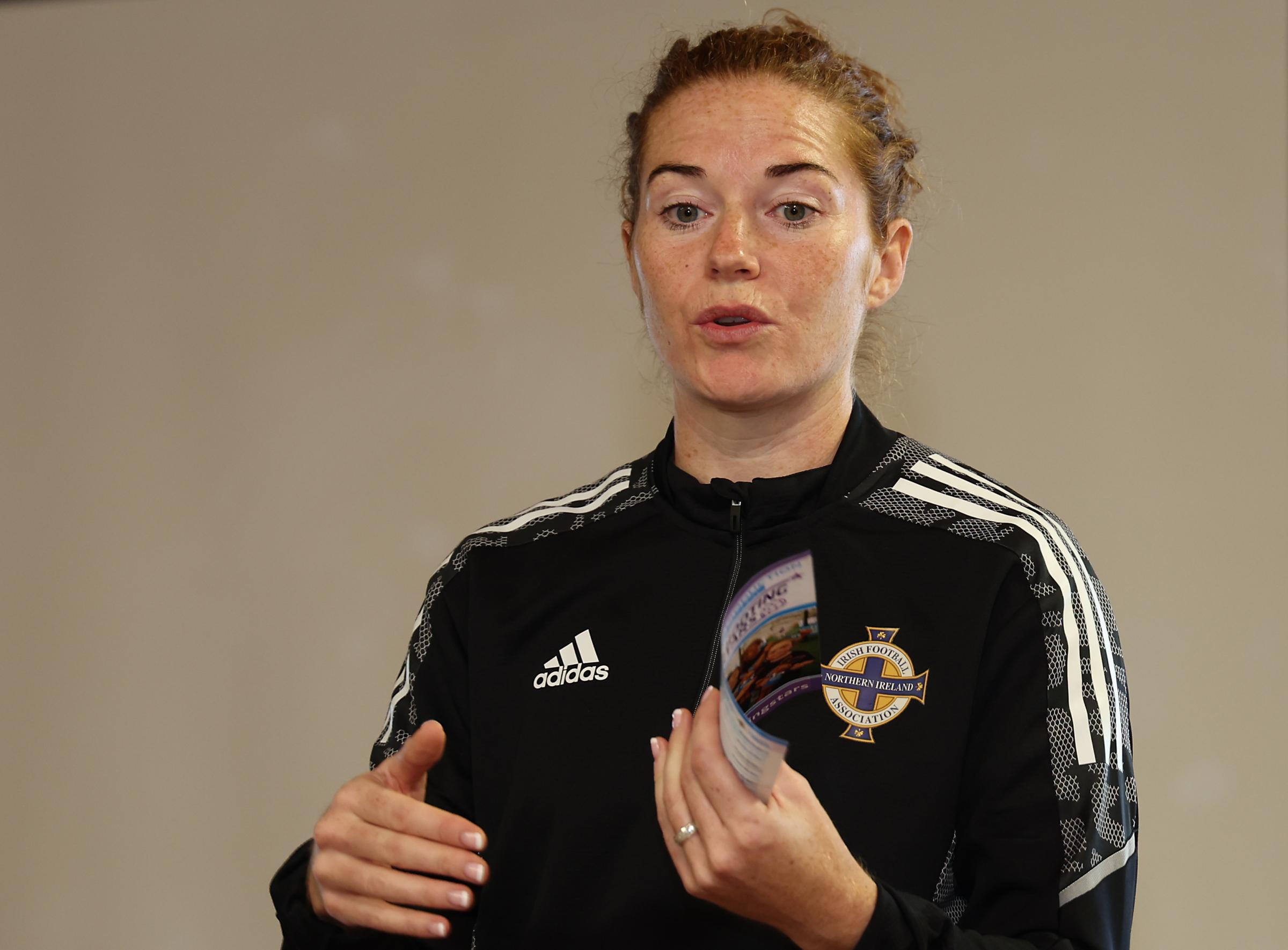 Marissa Callaghan, Northern Ireland Captain and IFA Diversification Officer, speaking to pupils at Jones Memorial Primary School.