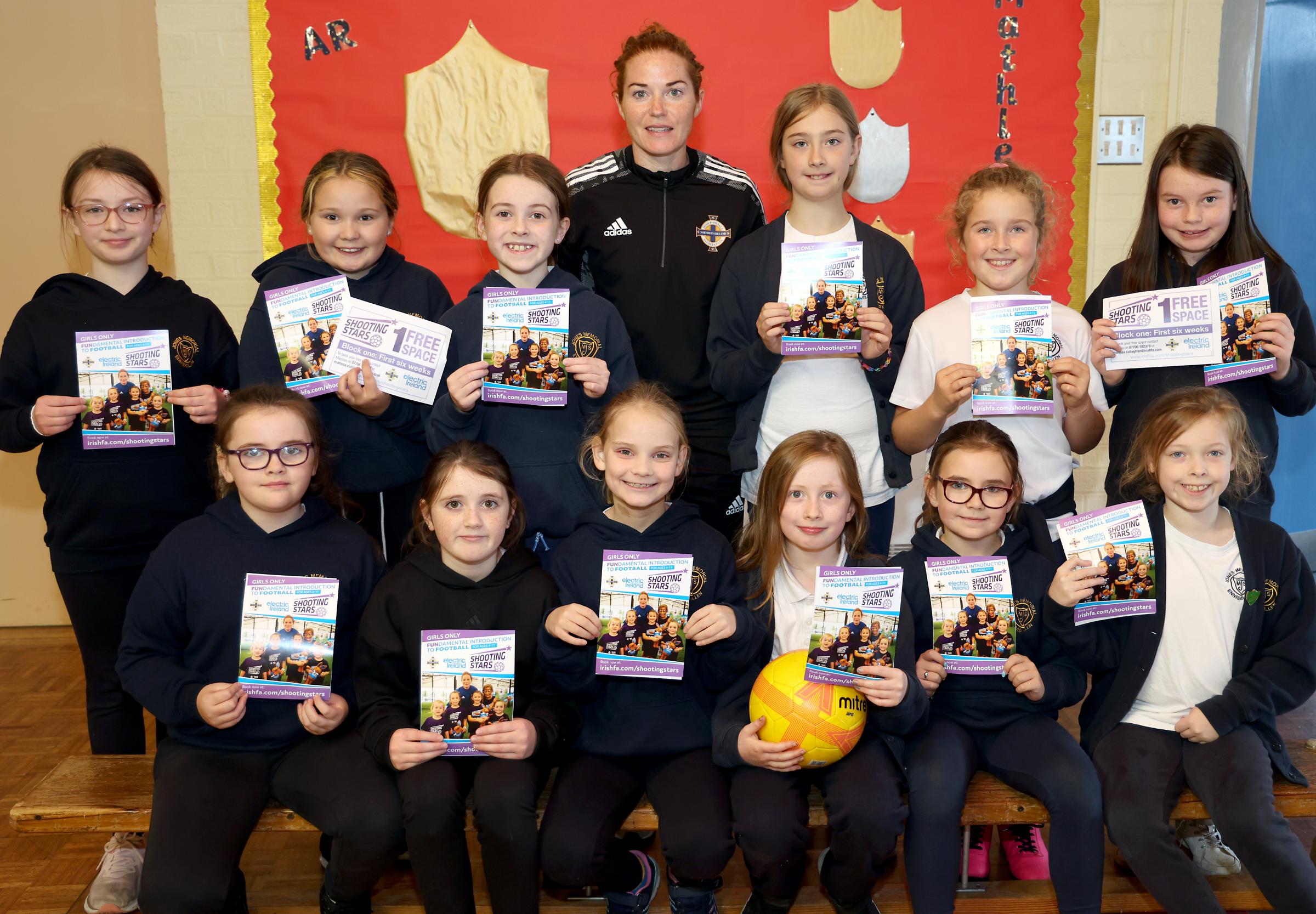 Marissa Callaghan, Northern Ireland Captain and IFA Diversification Officer, with P6 pupils at Jones Memorial Primary School.