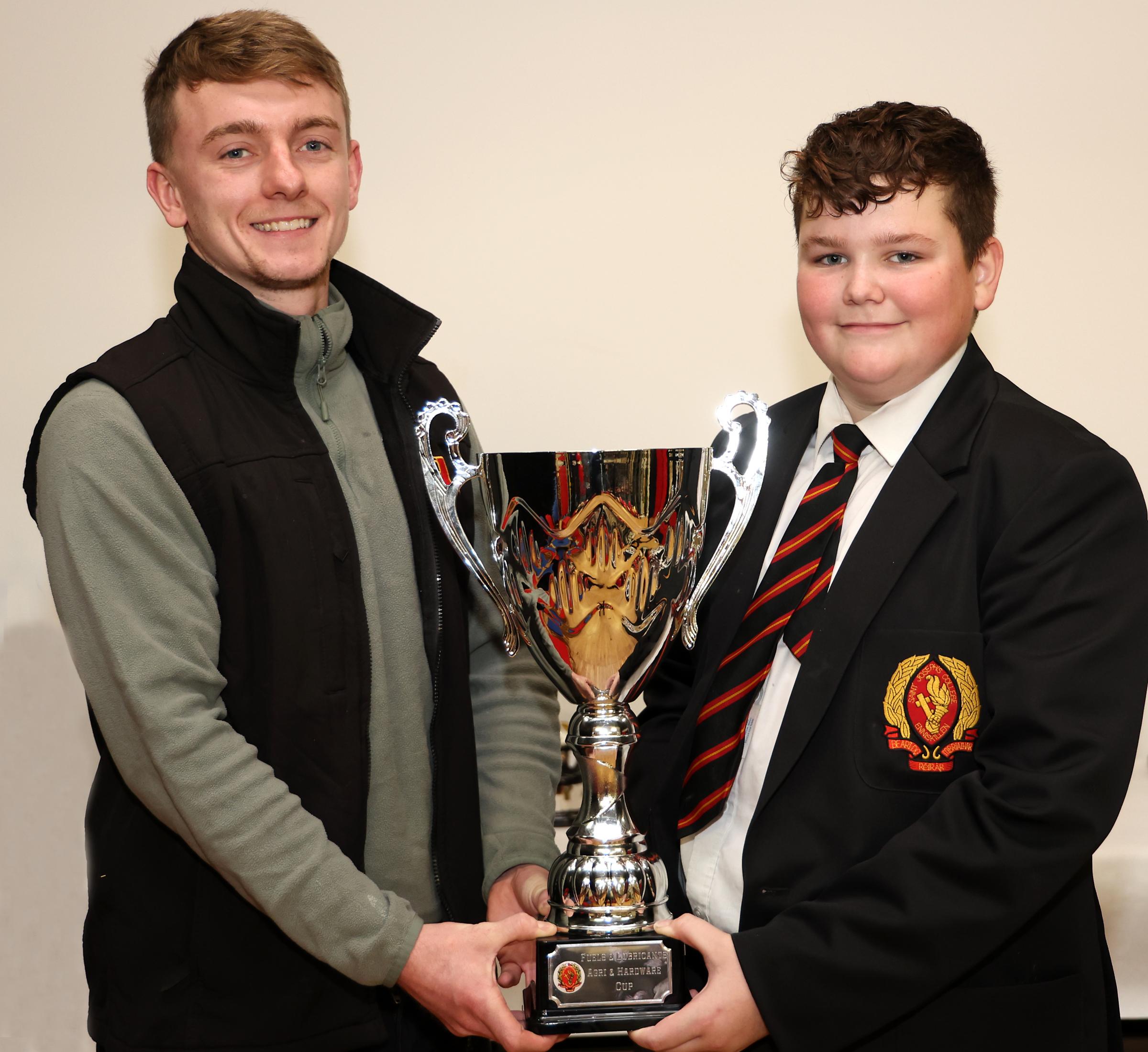 Student Sean Sheerin, recieving The Contribution To School Life Cup from Brendan Lilley, Fuels and Lubricants.