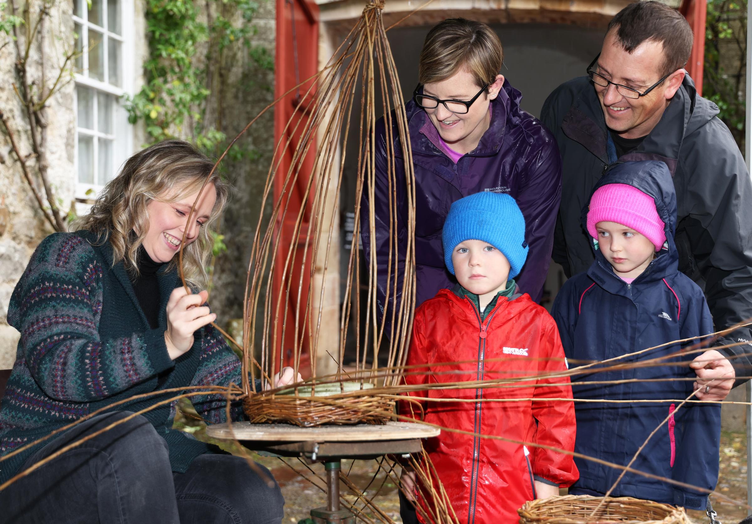 Ciara Smith, demonstrating the art of basket weaving to David, Nicola, Grace and Eddie Patterson, during the Harvest Fest at Florencecourt House.
