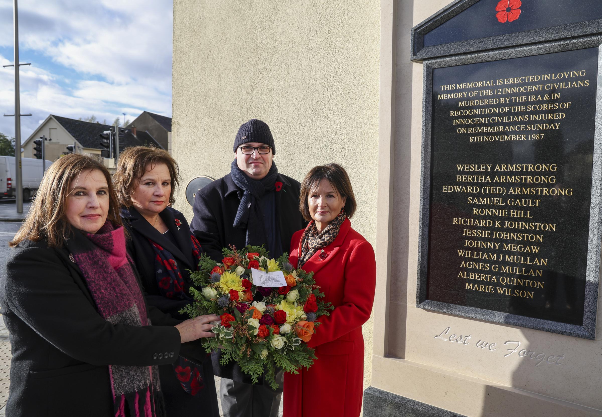 Moyna Nesbitt, Stella Robinson, Julian Armstrong and Pam Whitley, who layed a wreath in memory of their parents Wesley and Bertha Armstrong at the new memorial in Enniskillen.