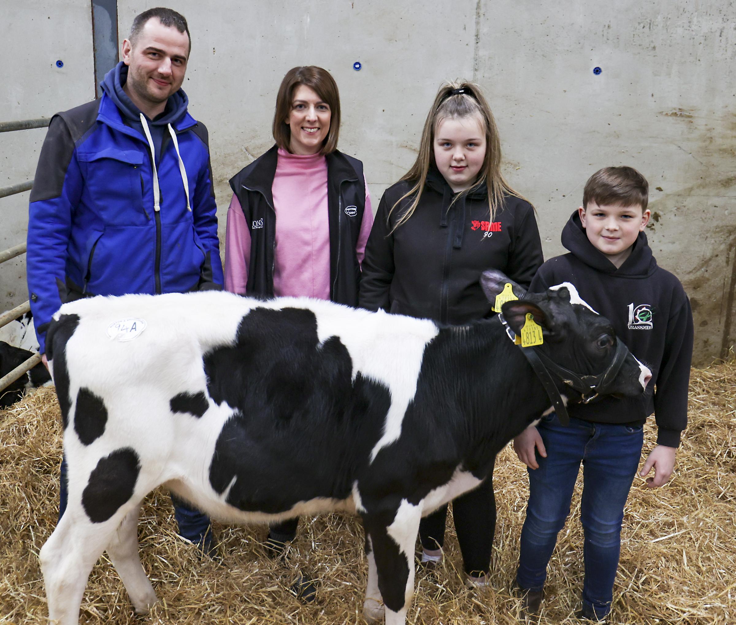 Philip and Joanne Wilson, who auctioned the calf in memory of their late daughter, Faith Isabella Wilson, are pictured with Abbi and Callum McBride, Trillick, who bought the calf.
