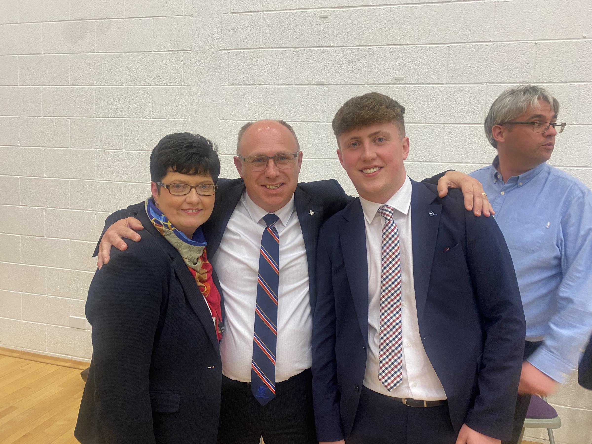 Roy Crawford is congratulated on his election by wife Carole and son Mark.
