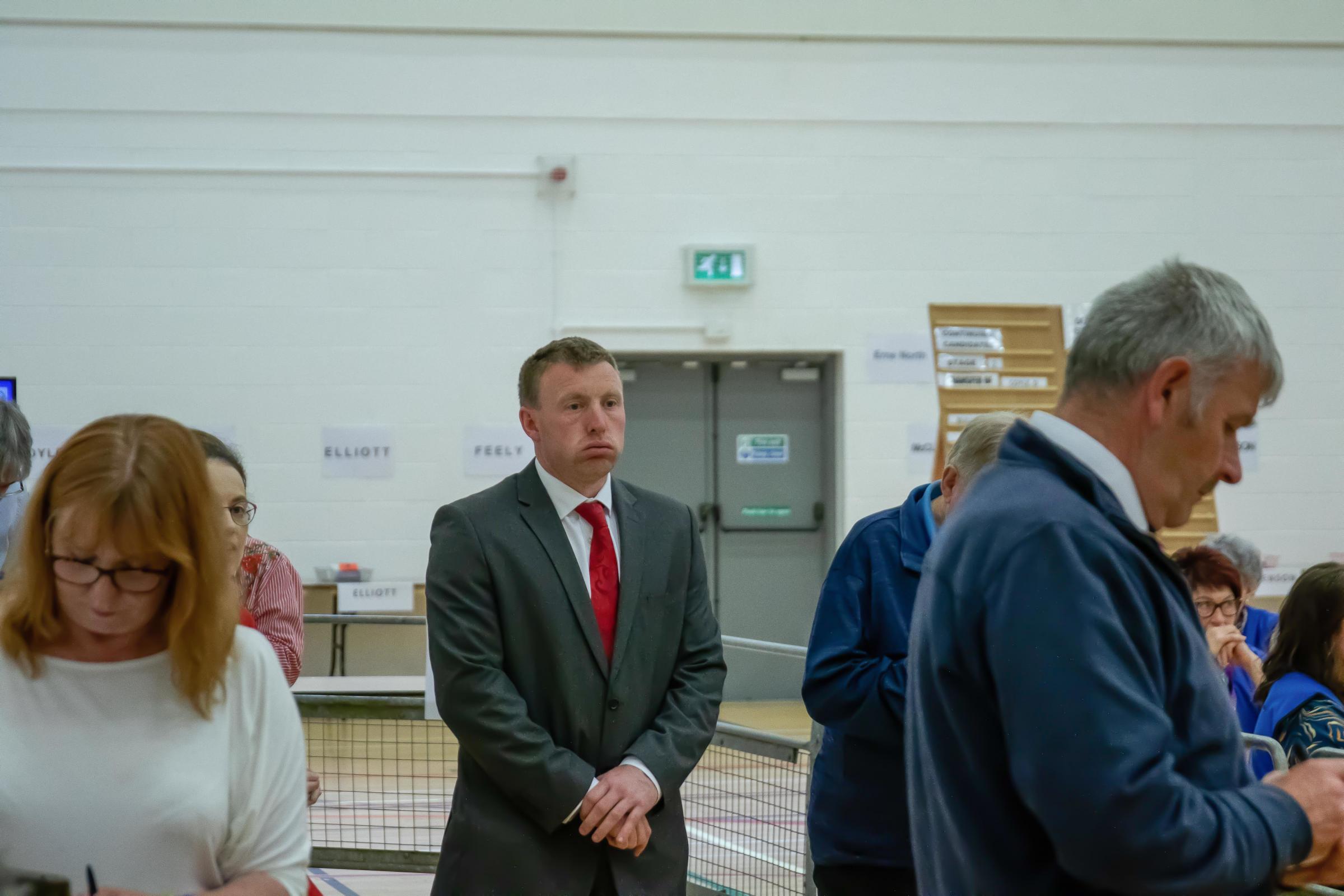 SDLP candidate, John Coyle, cuts a lonely figure as the Erne North count takes place last Saturday in Omagh Leisure Centre. He would miss out on re-election by the end of the count.