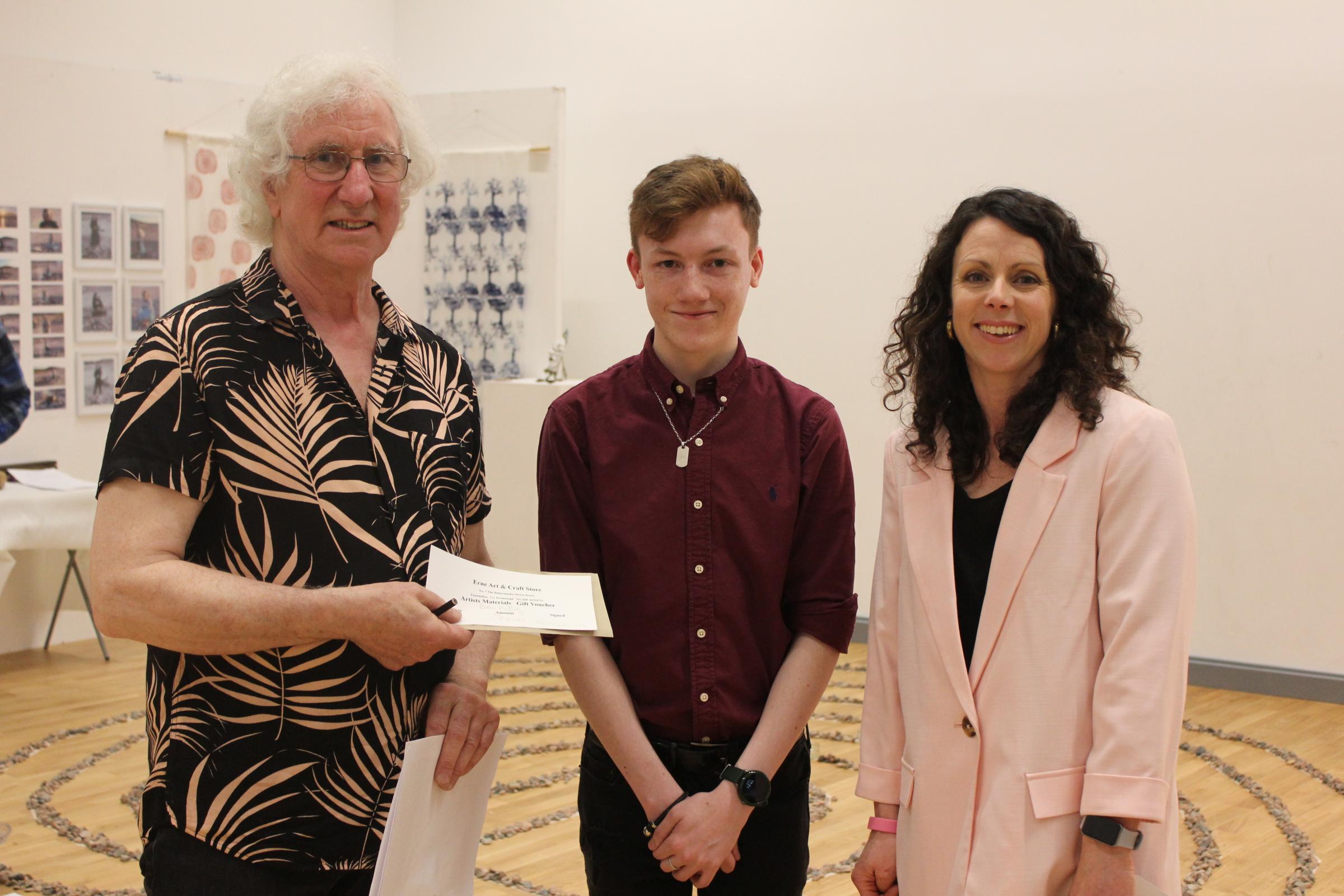 Ken Ramsey presents prize to student ?Ben Kelly for most innovative in show.