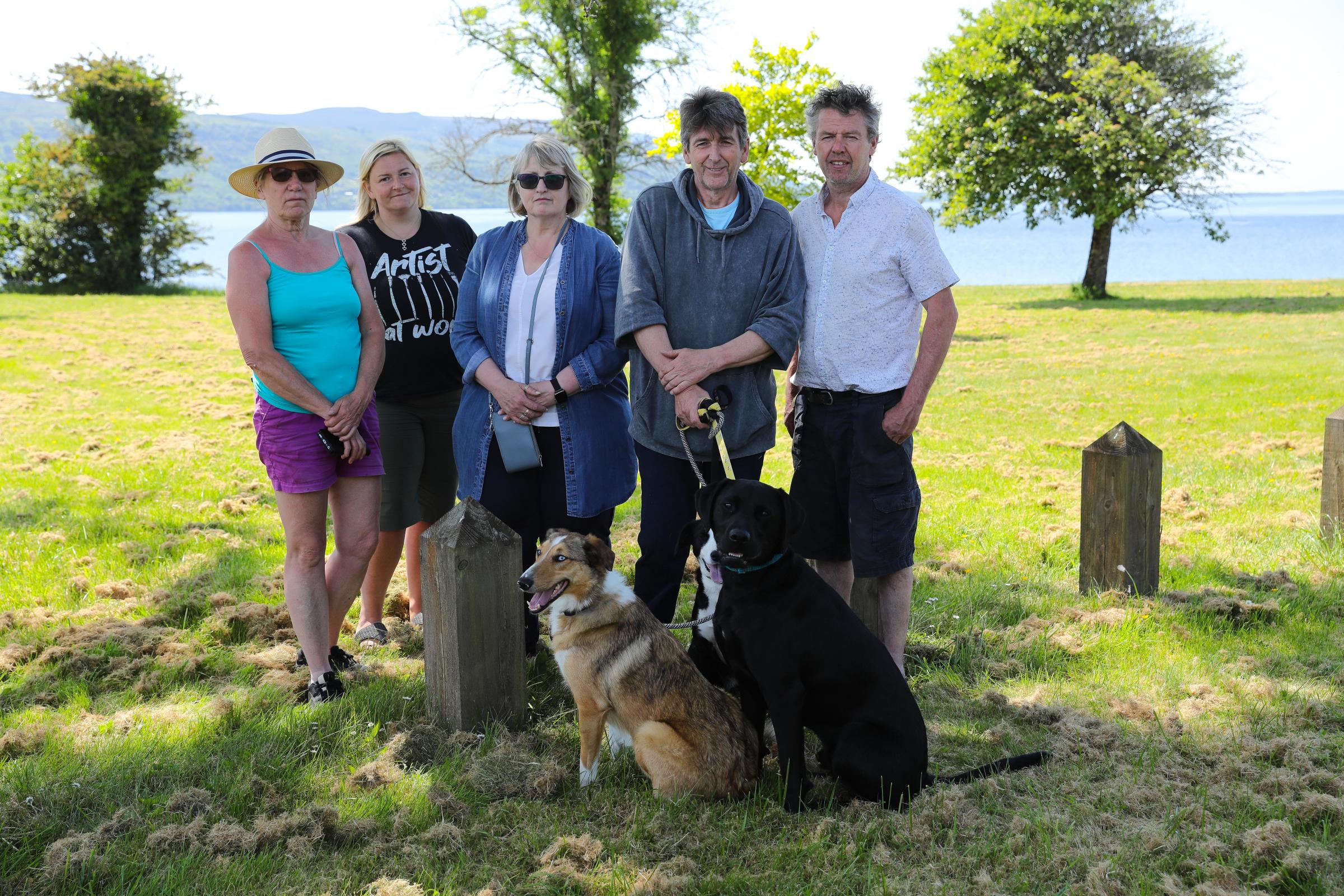 Pictured at Lough Melvin, from left: Amanda Heslop whose dog Mollie died after being on the shoreline Lough Melvin, Michelle Duffy, Alison and David McQuade, who lost their dog Axel, and Sinn Fein Councillor Anthony Feely.