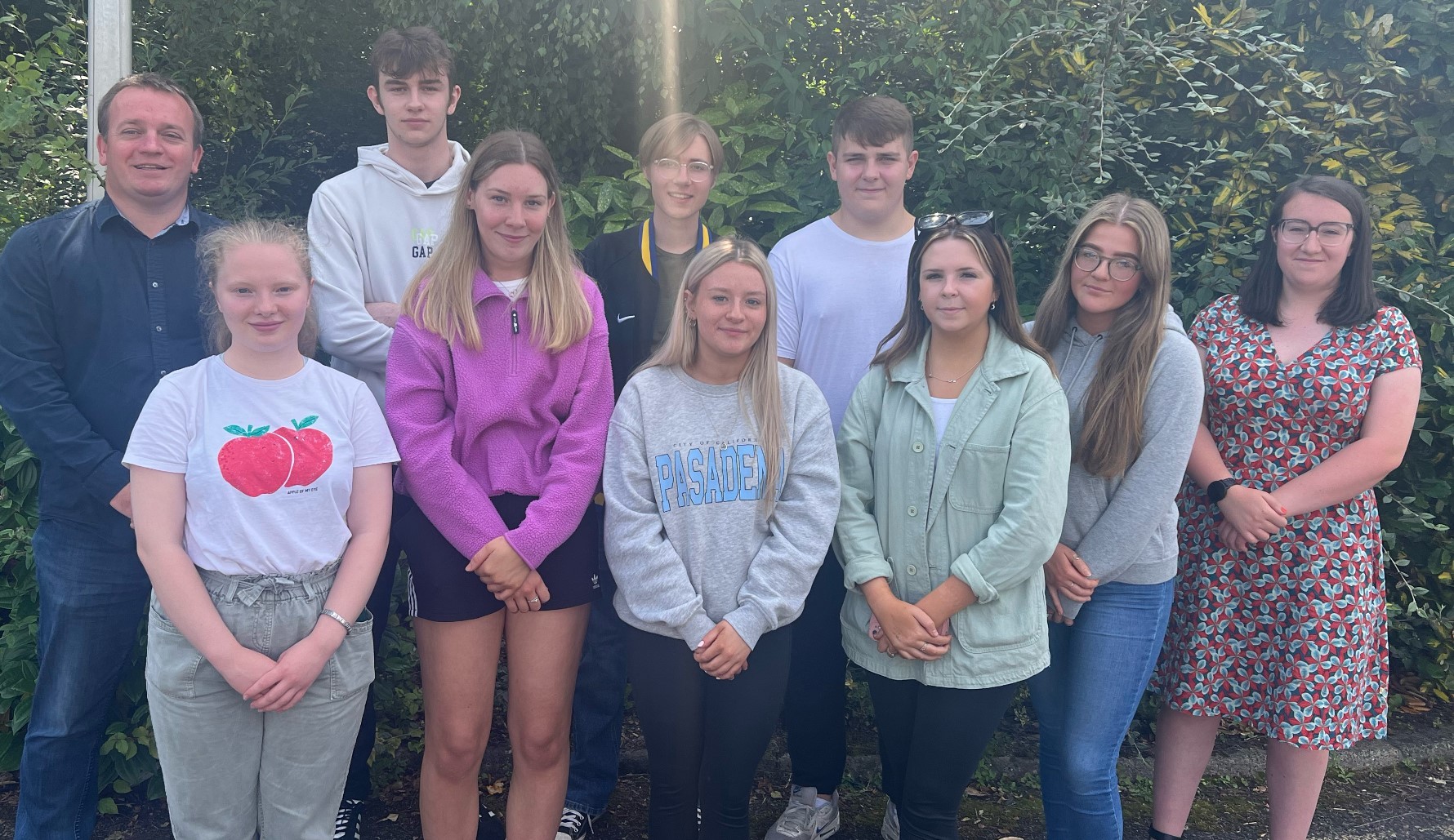 Devenish College students receiving their A-Level results. Front row, from left: Ashlyn Martin, Ellie McDonald, Connie Carson, Aimee Knox, Nia Robinson and Holly Bullock. Back row, from left: Principal Simon Mowbray, Ethan Malone, Matthew Graham and Joe