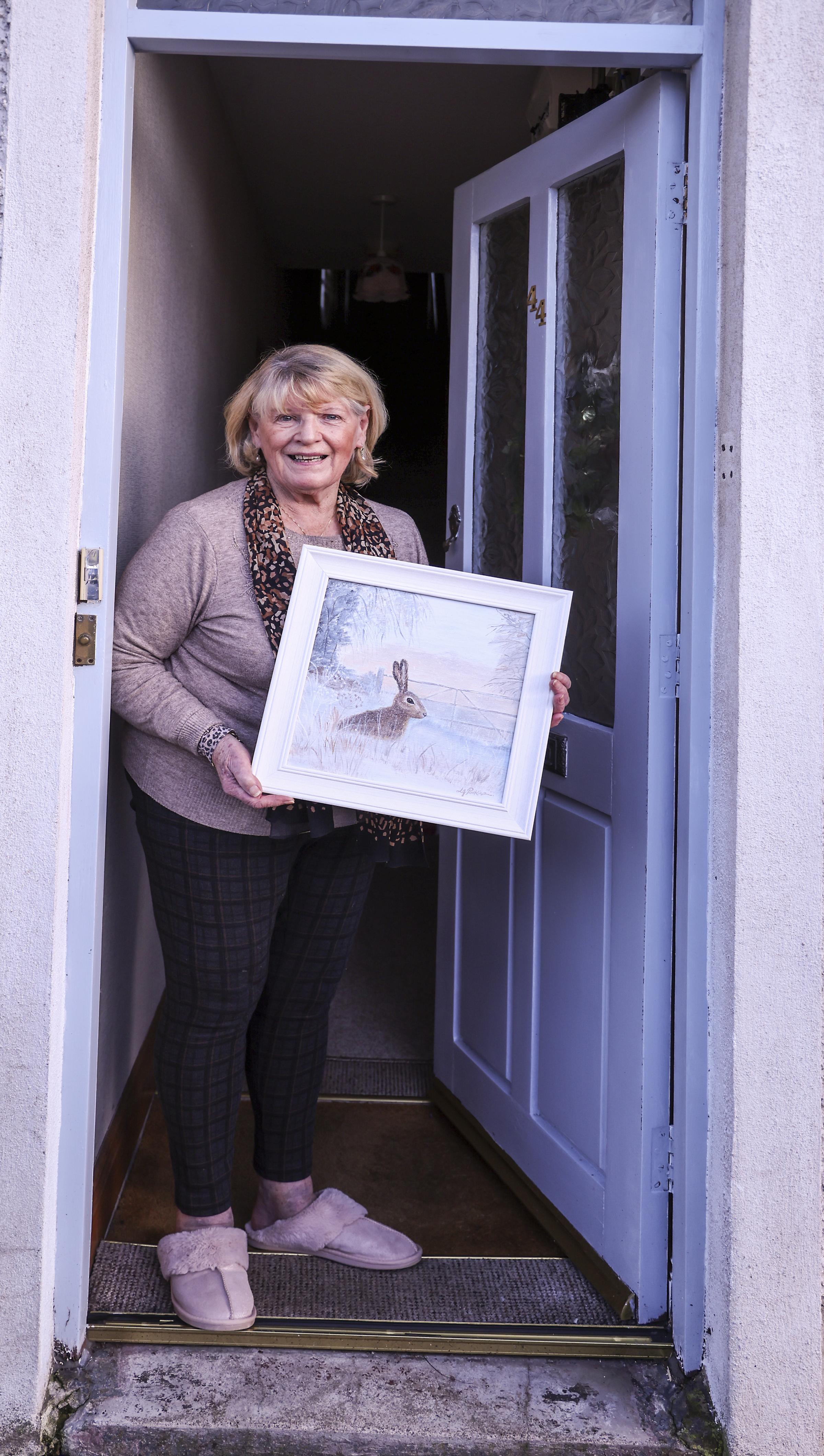 Lorna Parkinson, with one of her paintings.