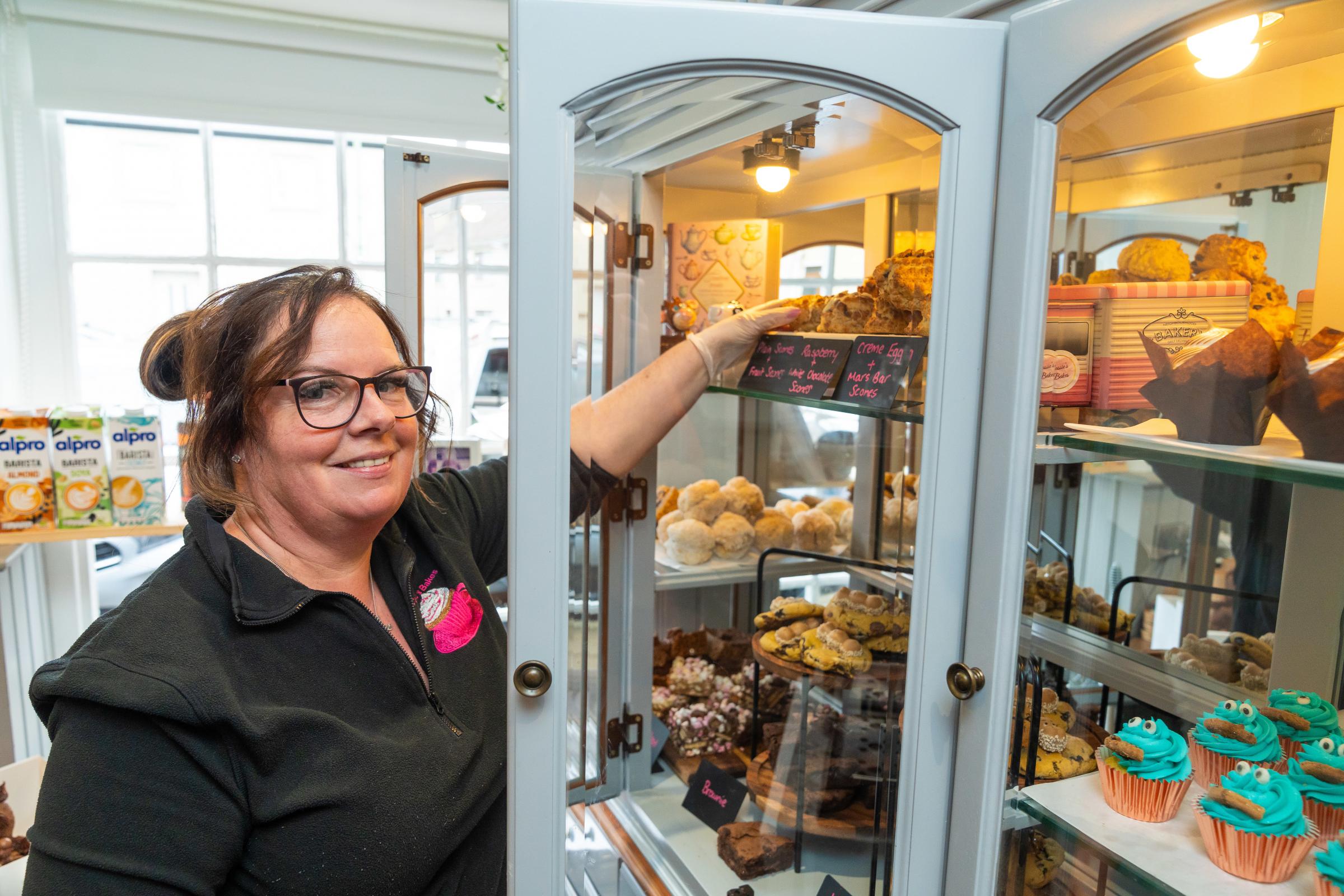 Kelly Hoey, from Cassies Bakes, stocking the display cabinet with treats at the Tea Rooms on Ederney Main Street.