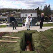 Father Gerard Alwill saying a prayer during the burial of Fermanagh’s first Covid-19 victim Anne Best, 72, at St. Ninnidh’s cemetery in Derrylin 2020. Photos by John McVitty. All photographs were taken with permission from Mrs. Best's family.