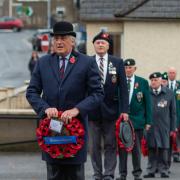 Attendees prepare to lay a wreath at the Remembrance Day service in Fivemiletown.