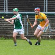 Caolan Duffy clears defence before Aaron McDermott can close in