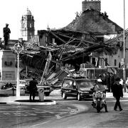 A funeral passes the rubble-filled site of the Enniskillen Remembrance Day Bombing that occured on November 8, 1987.