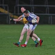 Jason Love collides with Eoin Maguire