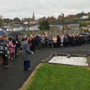 Attending the Annual Act of Remembrance at The SEFF Memorial located within the grounds of Holy Trinity Church of Ireland, Lisnaskea.