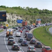 Traffic building up on the M3 southbound heading towards the coast, at Winchester, in Hampshire (PA)